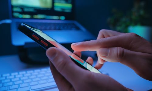 Close-up,Of,Persons,Hand,Taping,On,Smartphone,Screen,With,Social
